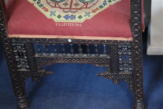 A late 19th century moorish open armchair and a similar armchair